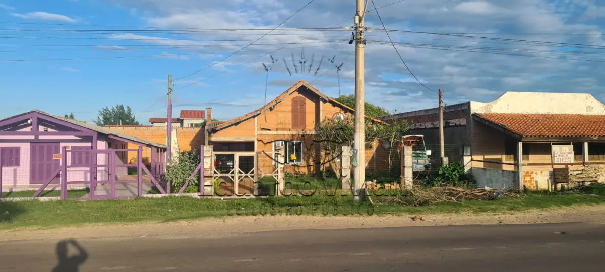 LOTE 001 - Em Cidreira, o Lote 21 da Quadra 54-E, matrícula no RI nº 25.396, na Av. Central - Fausto de Borba Prates - nº 5.557.