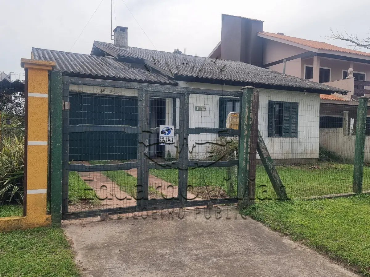 LOTE 001 - Em Imbé, no Balneário Presidente, na Rua Tiradentes, o Lote 26 da Quadra E-05, casa e terreno, a qual recebeu o número 1054