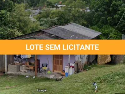 LOTE 001 - Em Santo Antonio da Patrulha, na Rua Paulo Renato Massulo Maciel, nº 27, na esquina com a Rua Francisco Flores Alvares, o imóvel matricula 9865.