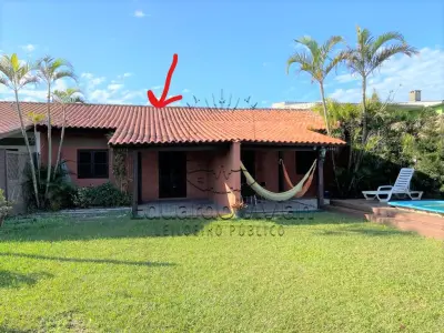 LOTE 001 - Em Imbé, os direitos que o executado possui sobre o imóvel localizado na Rua David Canabarro nº 1171, Casa 01.
