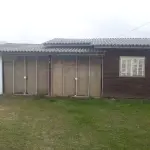 LOTE 003 - VENDA JUDICIAL DE RESIDÊNCIA EM BALNEÁRIO HARMONIA, NA RUA 28, Nº 74