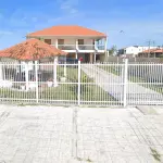 LOTE 001 - Em Tramandaí, um sobrado na Av. Alberto Pasqualini, nº 2262, sendo o Lote 14 da Quadra 170, tendo area de 450,00 m2, matricula no RI de Tramandaí 88.268.