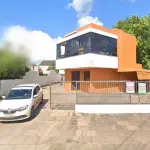 LOTE 001 - Apartamento em Tramandaí, na Rua Capitão Militão de Almeida, nº 695, o apartamento 102, matrícula no RI nº 136.395.