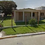 LOTE 001 - Uma casa em Capivari do Sul, situada na esquina das Ruas Professos Luiz Teixeira, nº 251 e 20 de setembro,